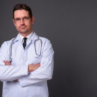 handsome-man-doctor-against-gray-background.jpg